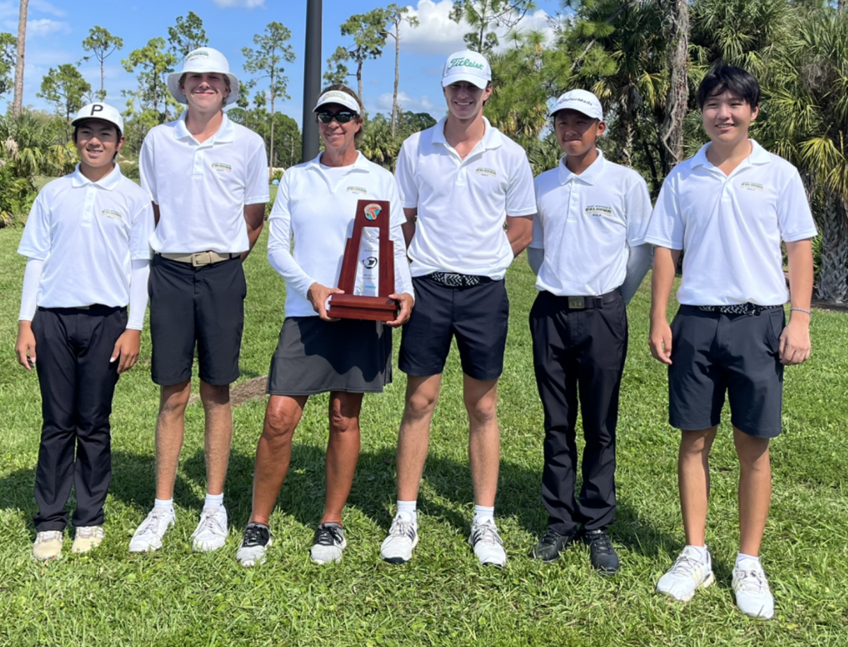 The+boys+golf+team+won+the+Region+3+championship+on+Tuesday+at+the+Valencia+Golf+and+Country+Club+in+Naples.++Coach+Judy+Carlson+proudly+holds+the+trophy.+